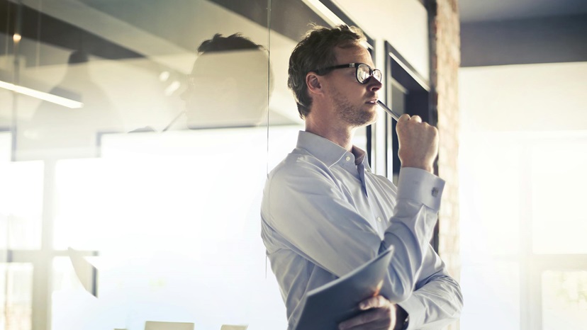 Photo by Andrea Piacquadio: https://www.pexels.com/photo/photo-of-man-in-white-dress-shirt-and-black-framed-eyeglasses-holding-a-file-thinking-3763998/